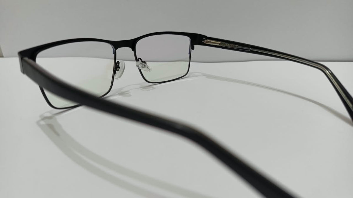 Three-quarter front view of gunmetal black rectangular eyeglasses