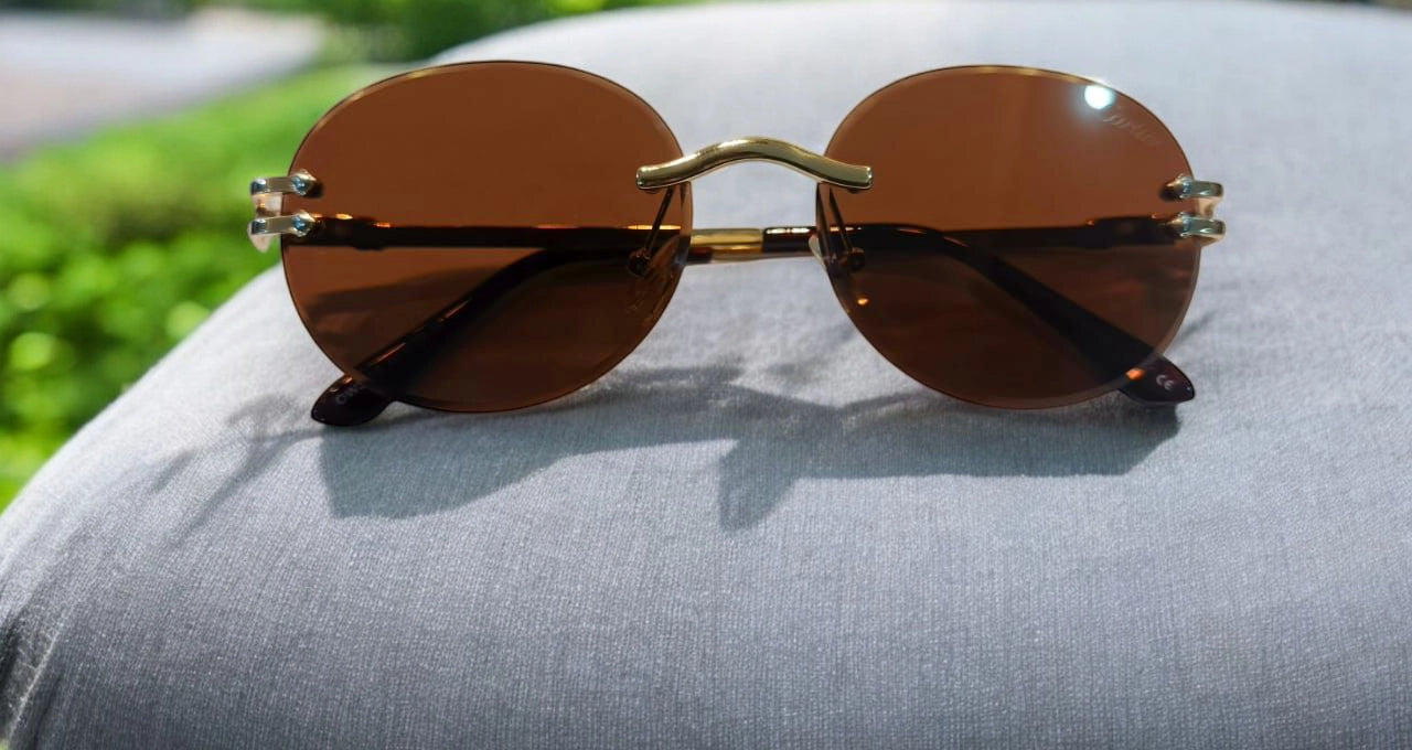 Sunset Vision: Classic Round Rimless Sunglasses