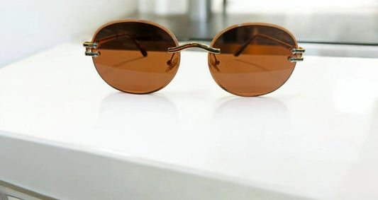 Sunset Vision: Classic Round Rimless Sunglasses