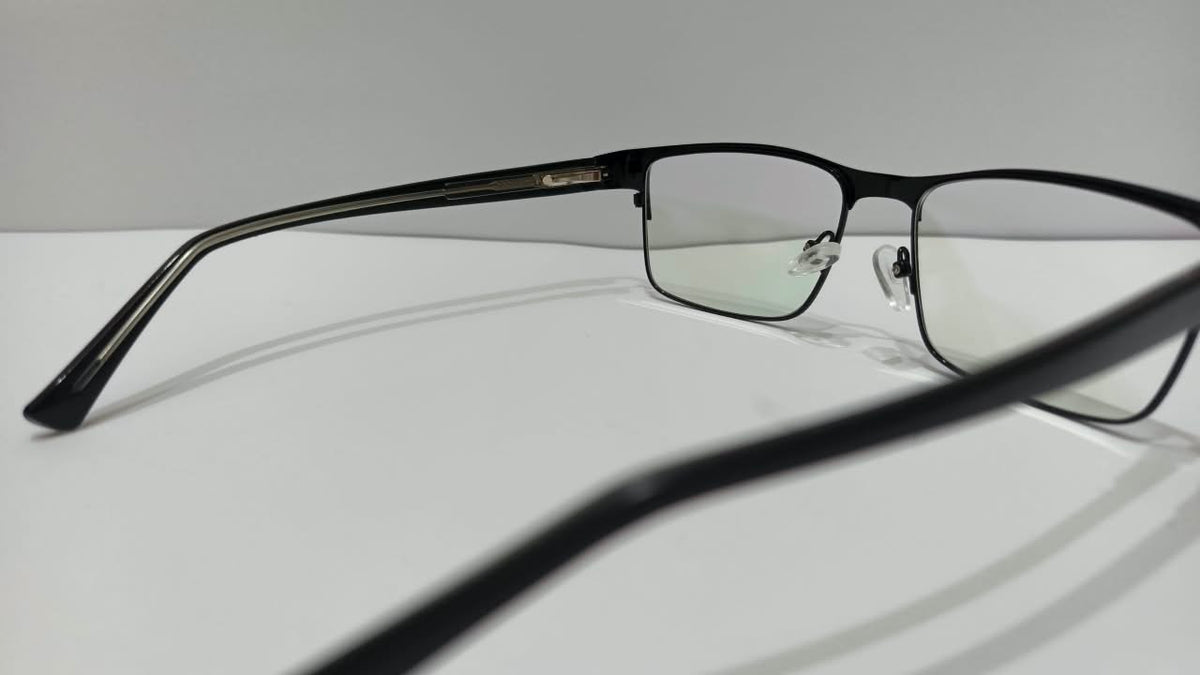 Side view of shiny black rectangular eyeglasses