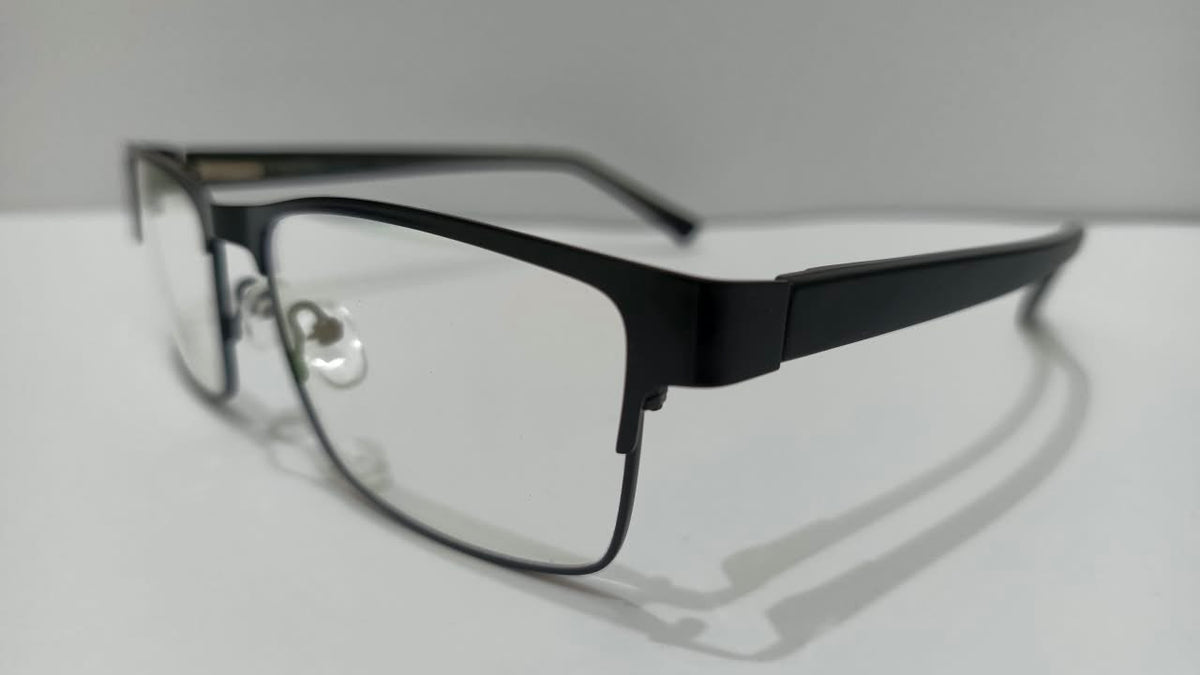 Three-quarter side view of shiny black rectangular eyeglasses