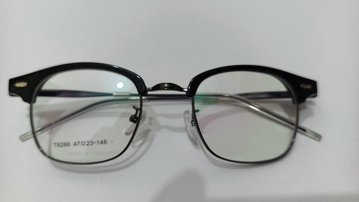 Front view of shiny black browline half-rim eyeglasses with size marking 47-23-146