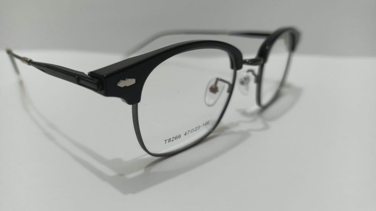 Close side view of shiny black browline glasses