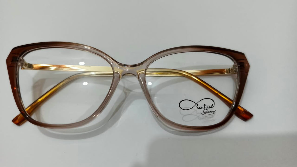 Front view of translucent brown cat-eye eyeglasses with gold-tone temples