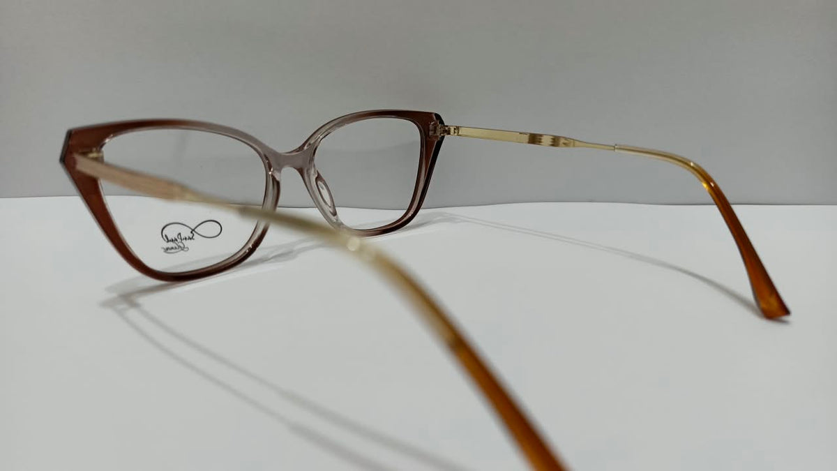 Side view of translucent brown cat-eye eyeglasses with gold-tone temples