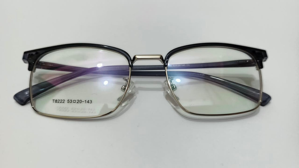 Front view of black and gold rectangular half-rim eyeglasses, model T8222, size 53-20-143
