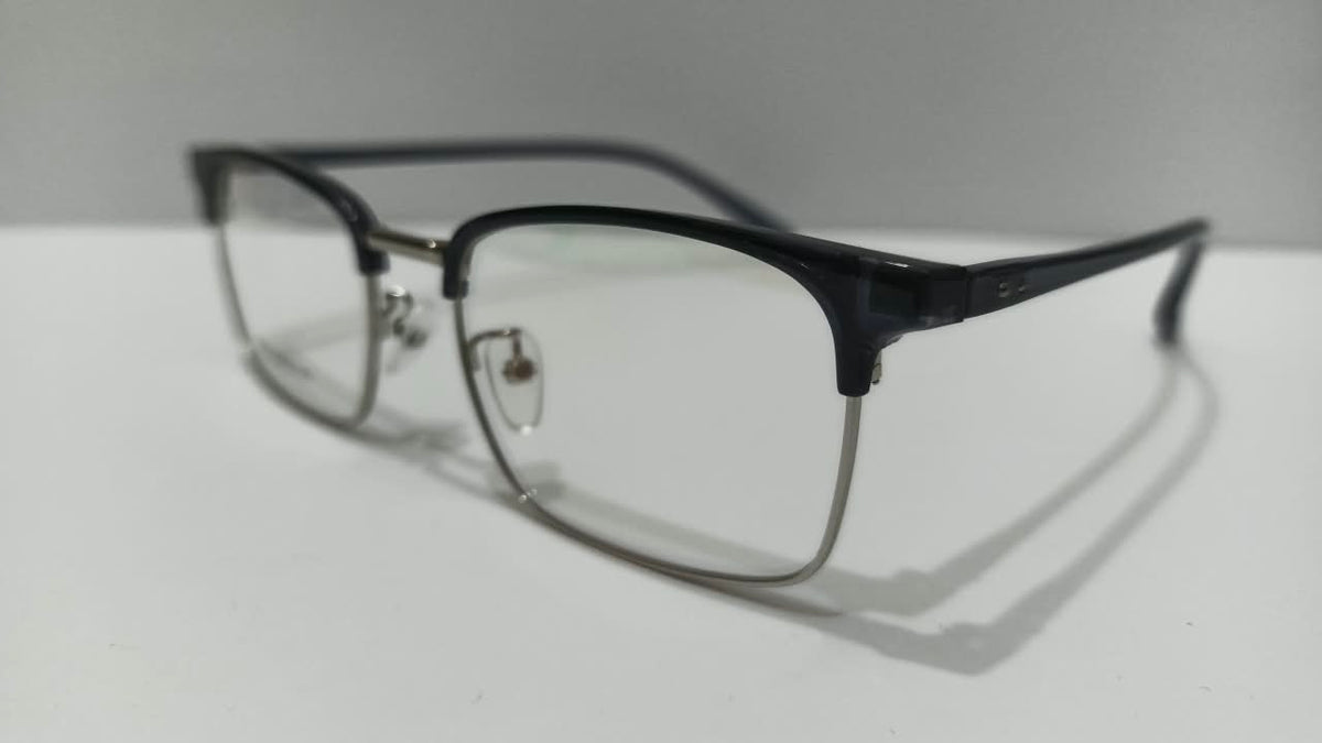 Three-quarter side view of black and gold eyeglasses
