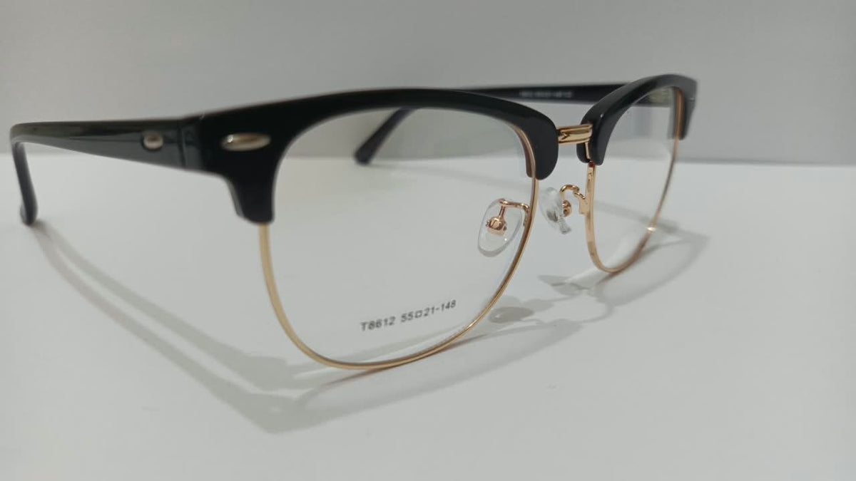 Angled view of black and gold browline half-rim eyeglasses, T8612 size 55-21-148