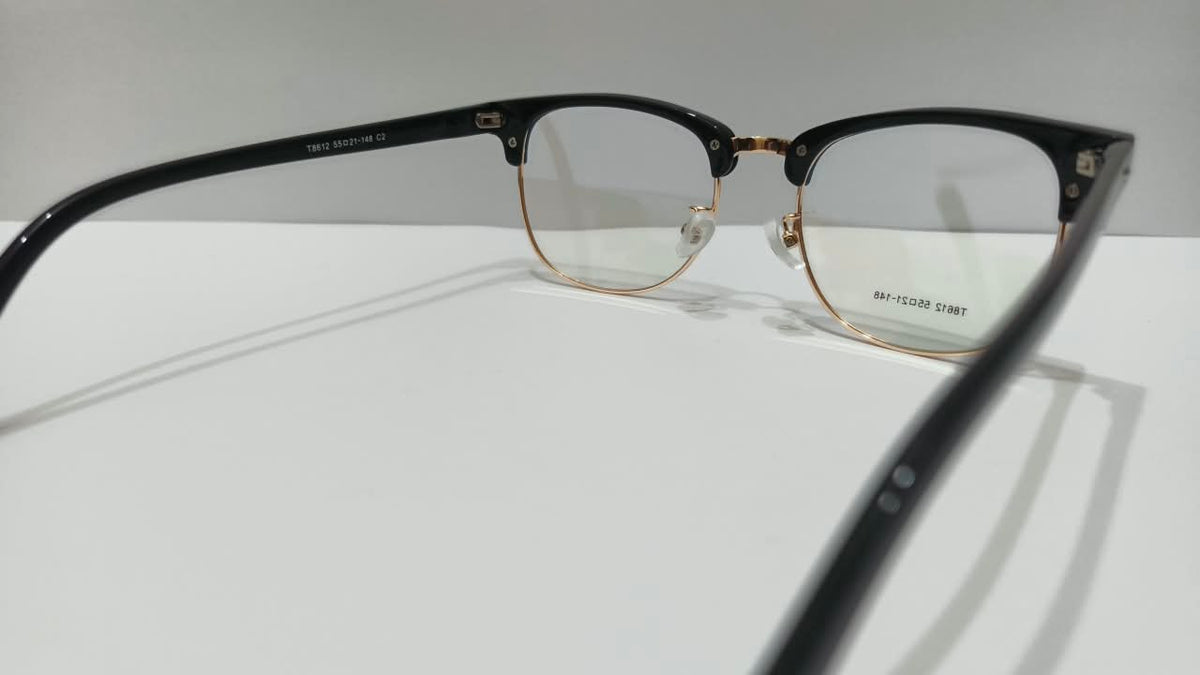 Inside view of black and gold eyeglasses showing frame details