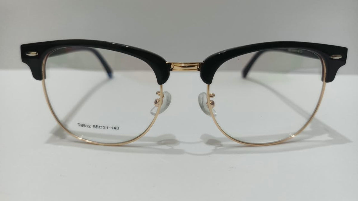 Front view of black and gold browline half-rim eyeglasses