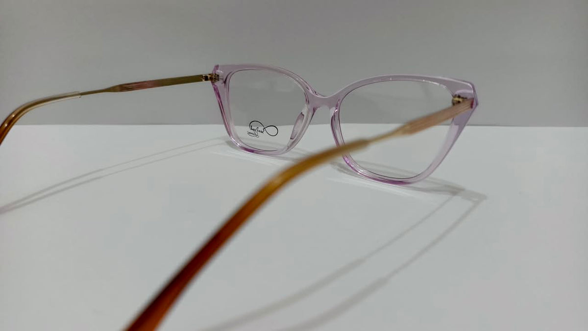 Angled view showing gold-tone temples on pinkish-purple glasses