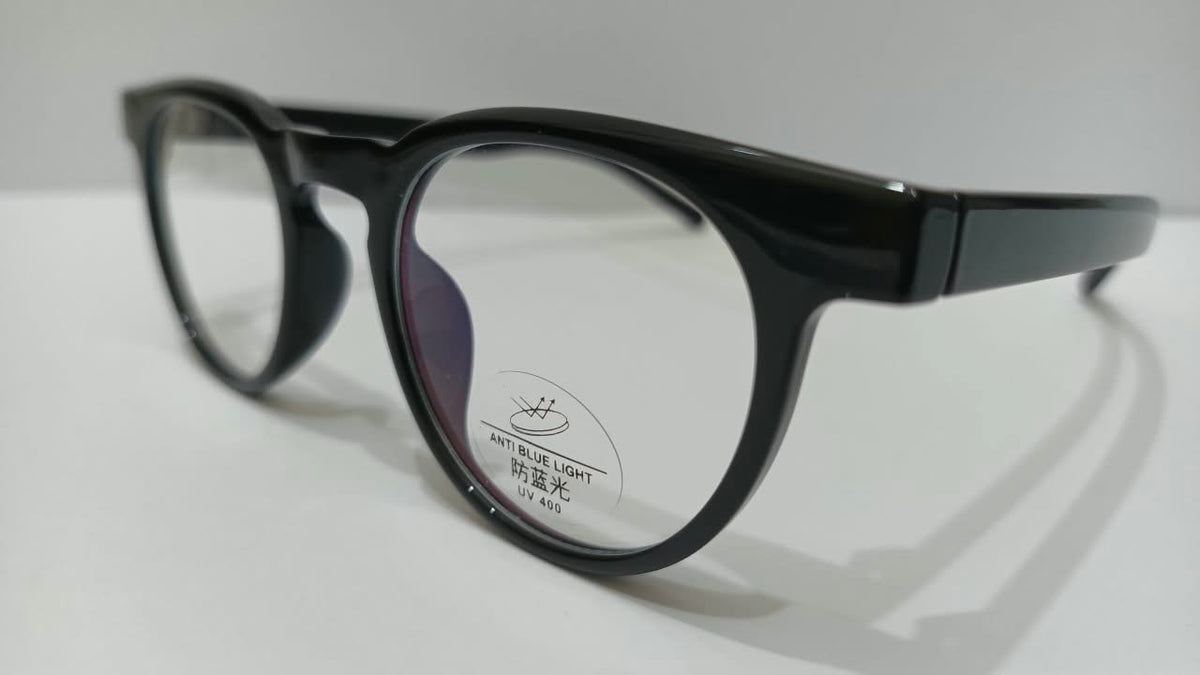 Angled close view of black eyeglasses with anti-blue-light UV400 lens label