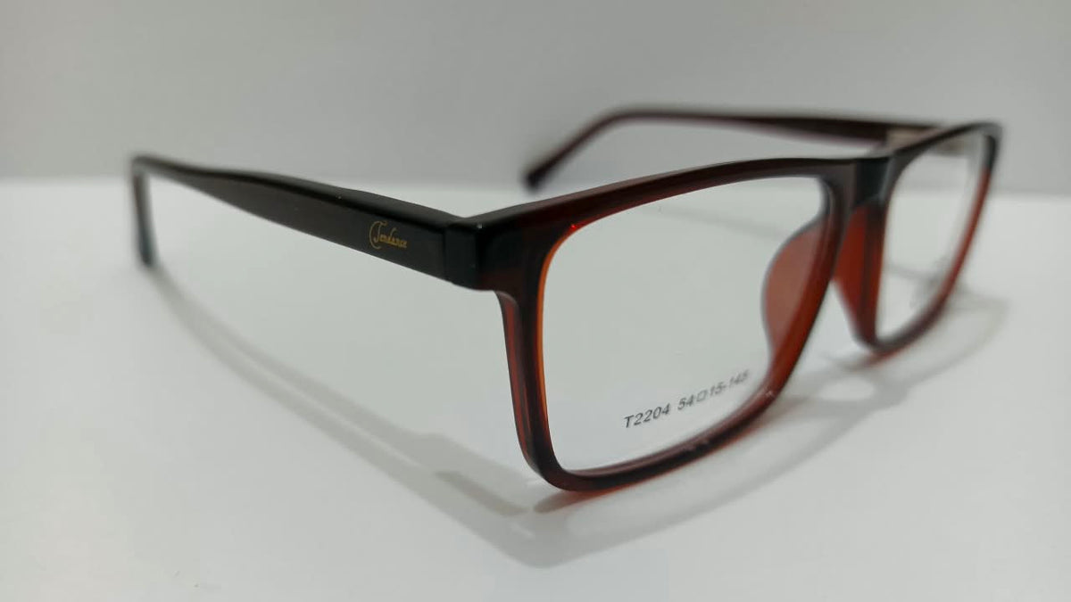 Tendence T2204 eyeglasses in translucent burgundy, angled view