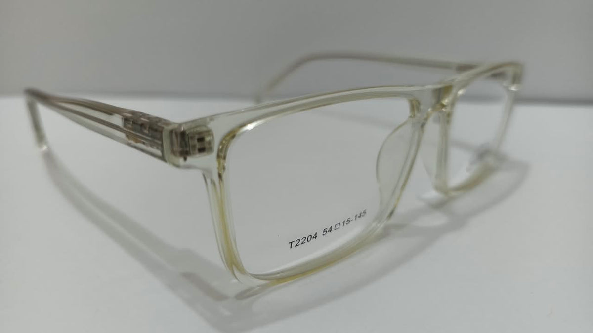 Angled view of clear pale champagne T2204 rectangular eyeglasses