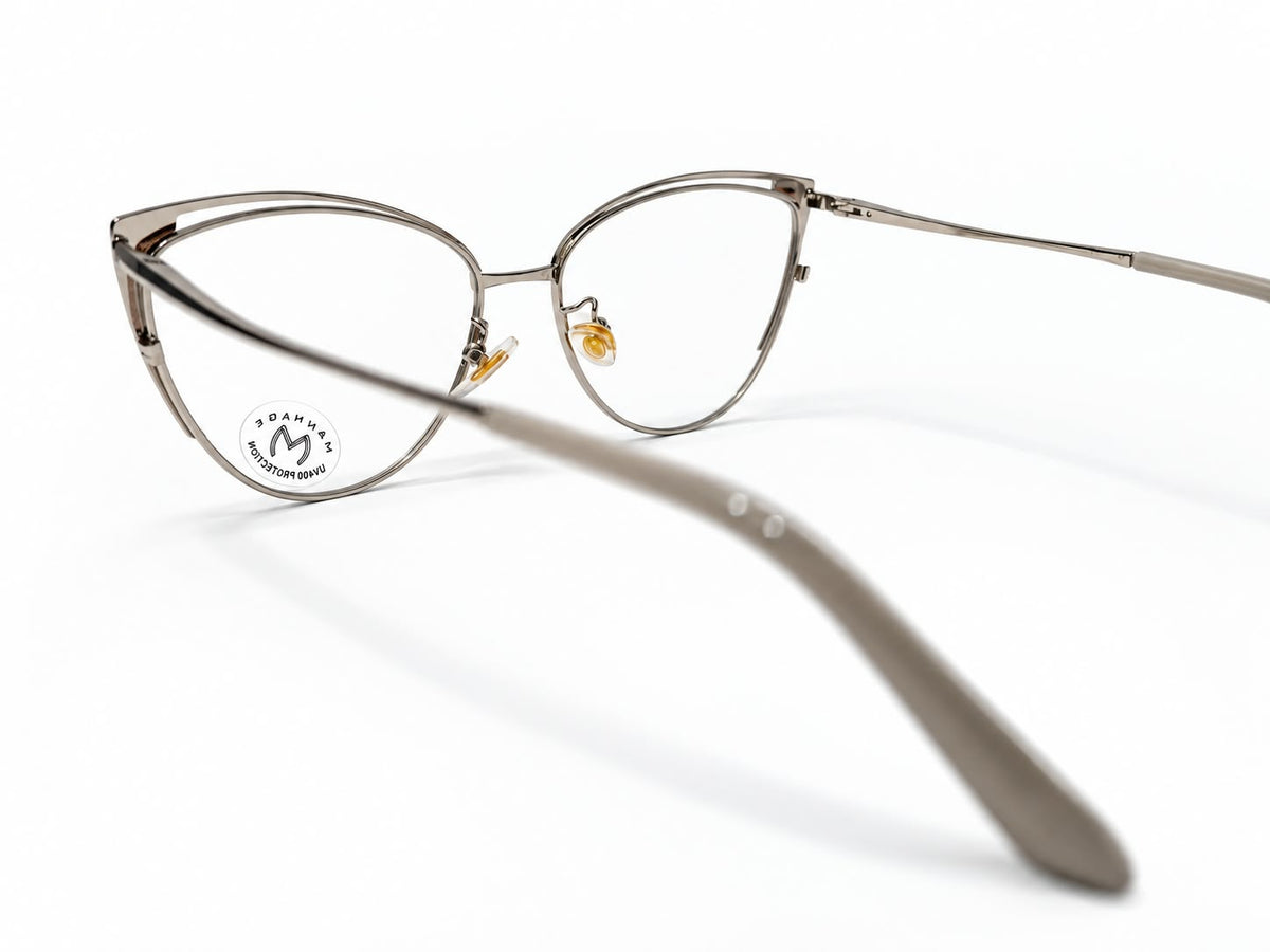 Ladies slate grey and silver-tone cat-eye prescription eyeglasses with gold-tone corner details, size 52-17-134