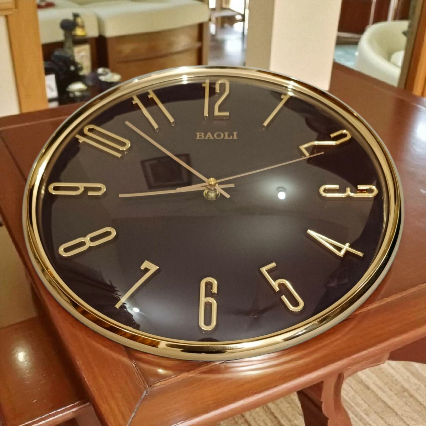 Modern Elegance Baoli Wall Clock: Black & Golden Accent Piece