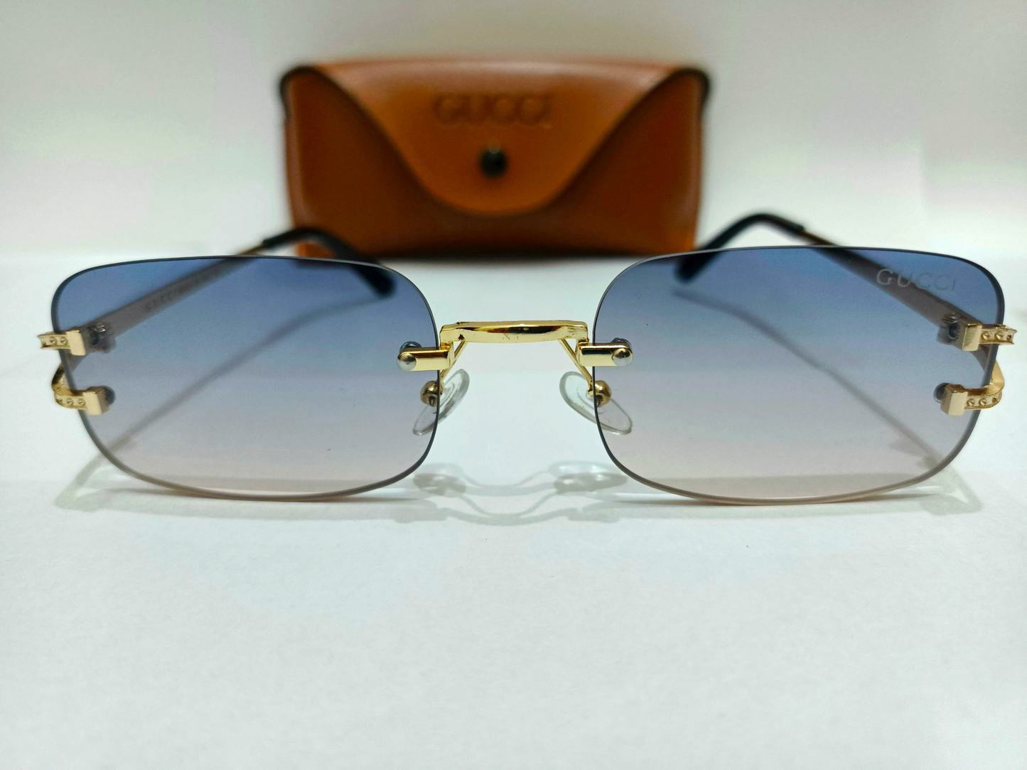 Gucci Inspired Rimless Gradient Sunglasses with Gold Accents - Made in Italy mentioned.