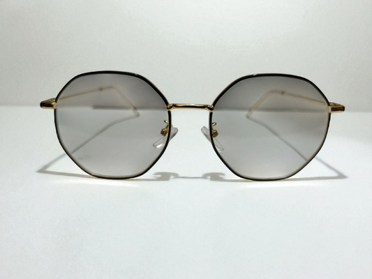 Premium Octagon Rimless Eyewear – Golden Frame with Gradient Lenses | Bird Eye Optics
